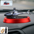 Solar-powered helicopter car air freshener on a car dashboard