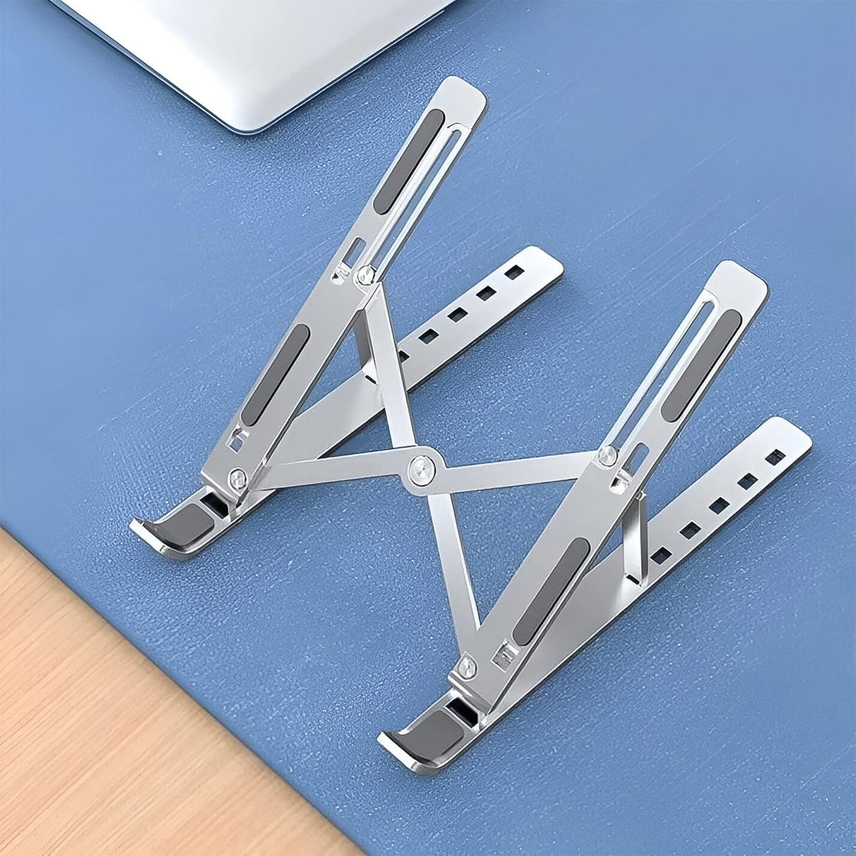 Elevated laptop positioned on foldable stand