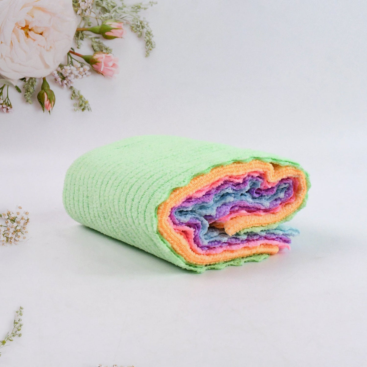 Microfiber cloth absorbing water on surface