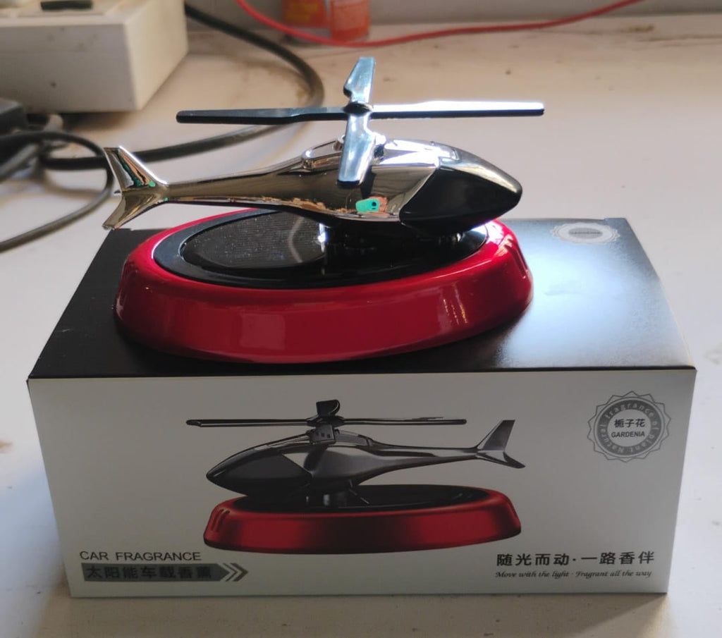 Solar helicopter air freshener showing essential oil refill