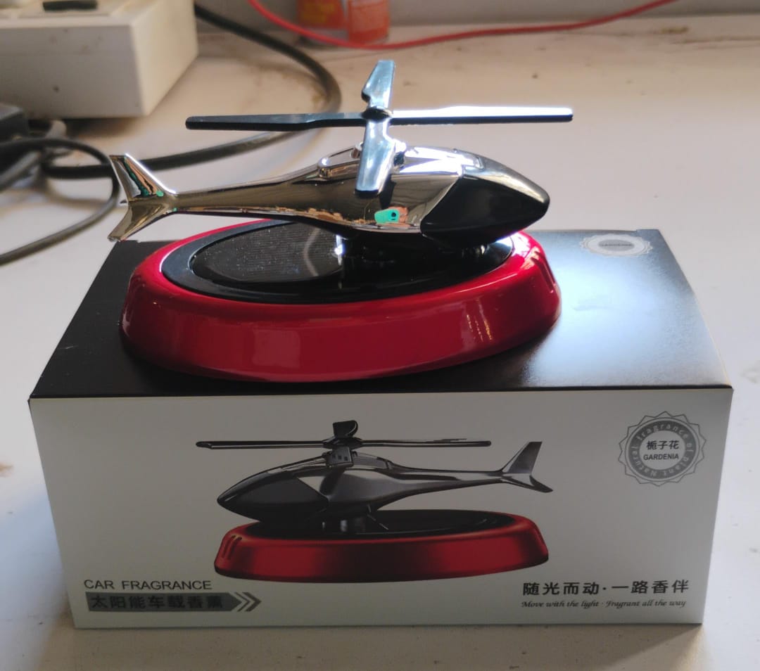 Solar helicopter air freshener showing essential oil refill