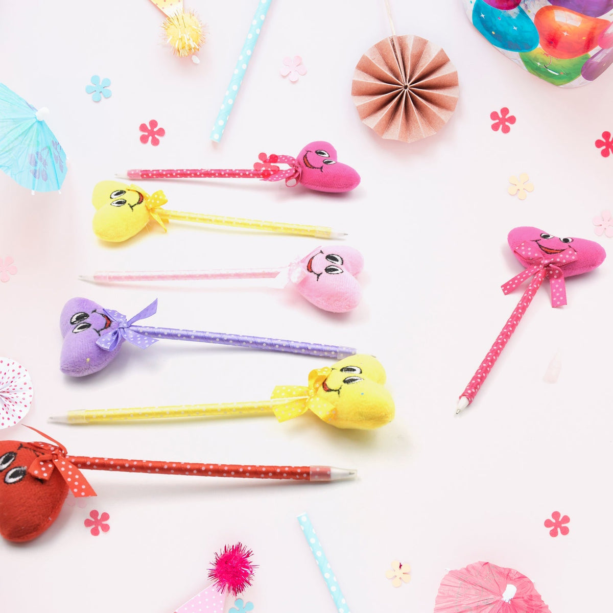 Assortment of 12 cartoon and heart design ballpoint pens with rattles