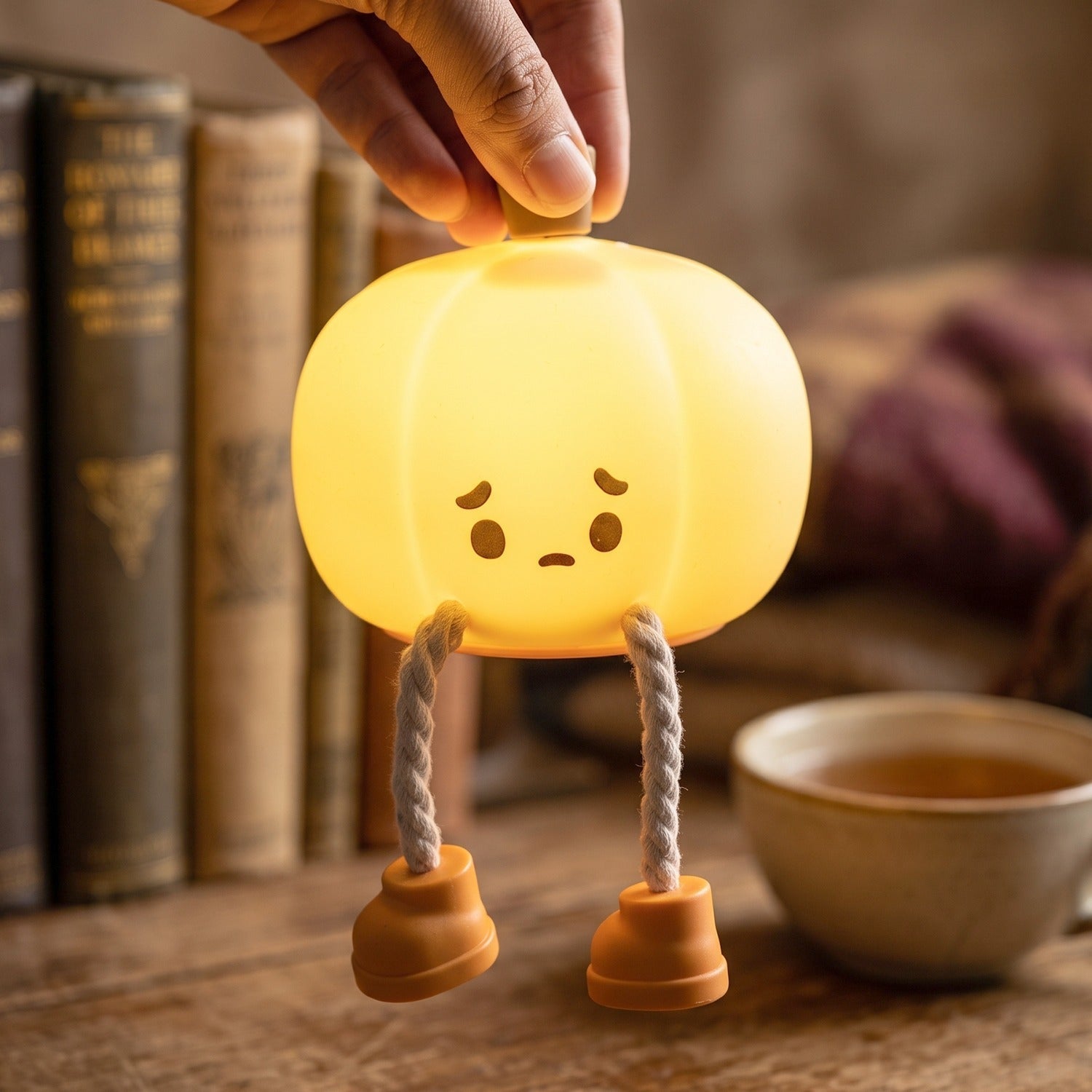 Soft silicone pumpkin night light, USB rechargeable. Perfect for kids' rooms, image 8 of 9.