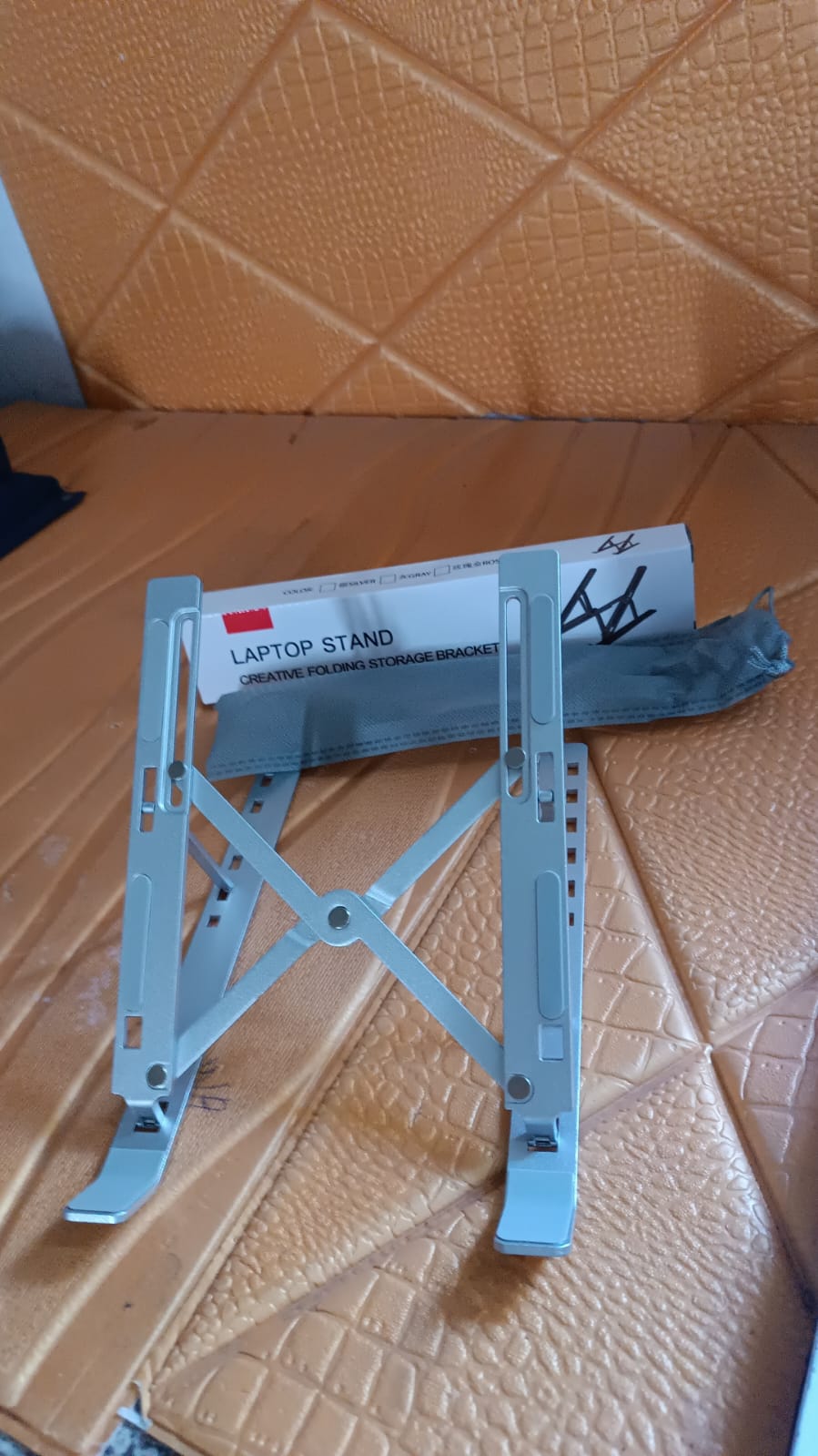Laptop stand angled for ergonomic use