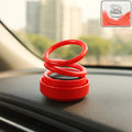 Small solar-powered car aroma diffuser on dashboard