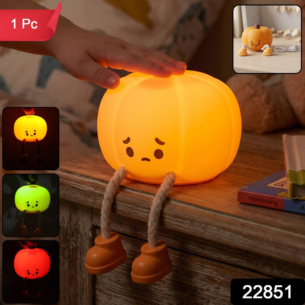 Soft silicone pumpkin night light, USB rechargeable, glowing warmly. 2/9
