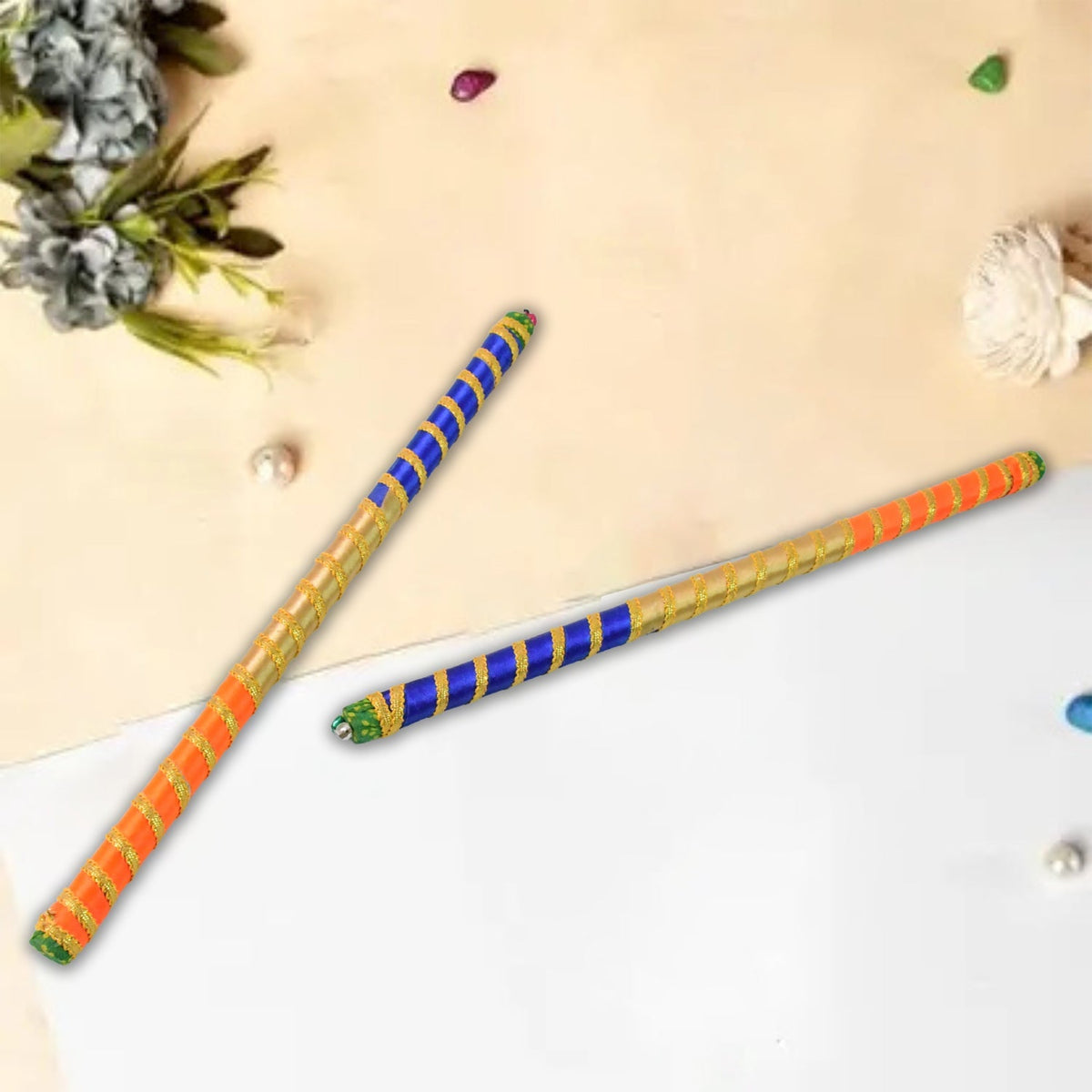 Pair of dandiya sticks with traditional decorative design